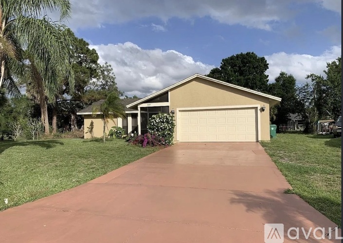 A house with a driveway in front of it.