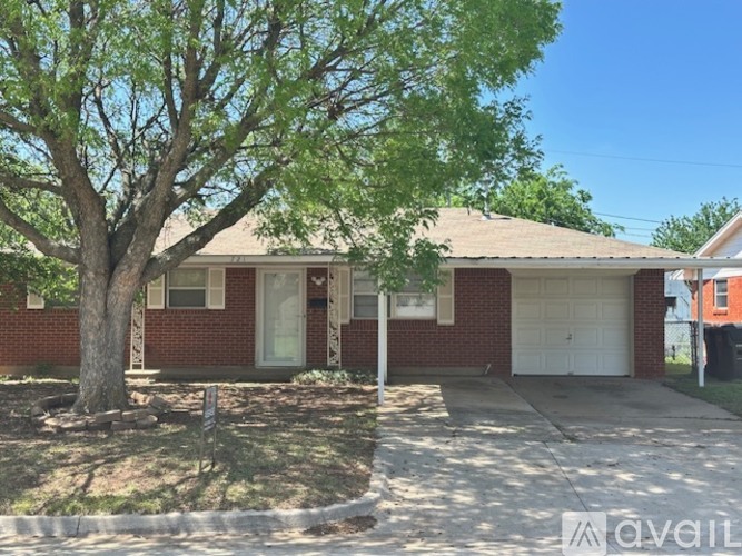 A house with a tree in front of it.