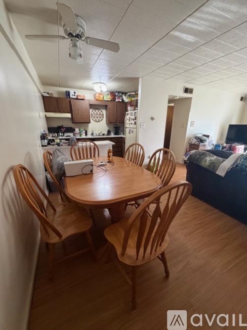 A room with a table and chairs in it.