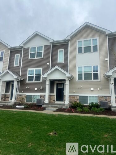 A row of houses with the Avail logo in the front yard.