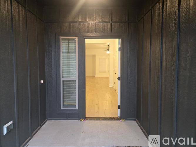 A room with a door and a window is shown.