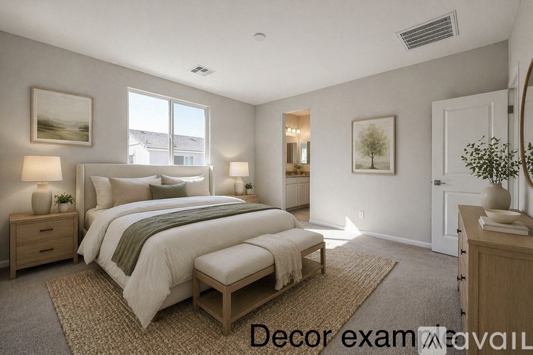 A bedroom with a large bed, two nightstands, and a bench.