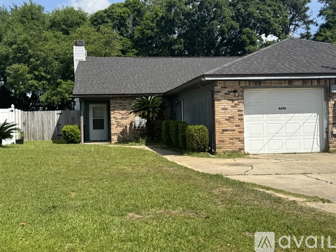 A house with a garage door numbered 6490 is for sale.