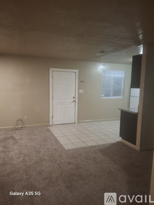 A room with a door and a window.