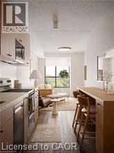 A kitchen with a table and chairs in front of a window.