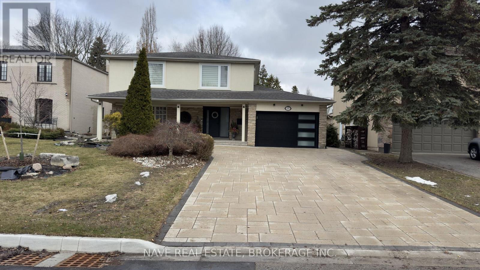 A house with a driveway in front of it.