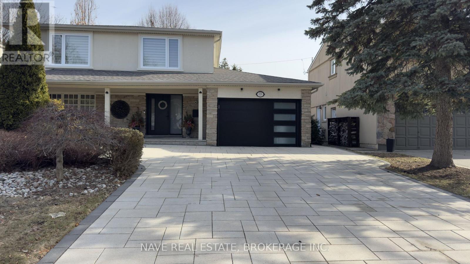 A house with a driveway in front of it.