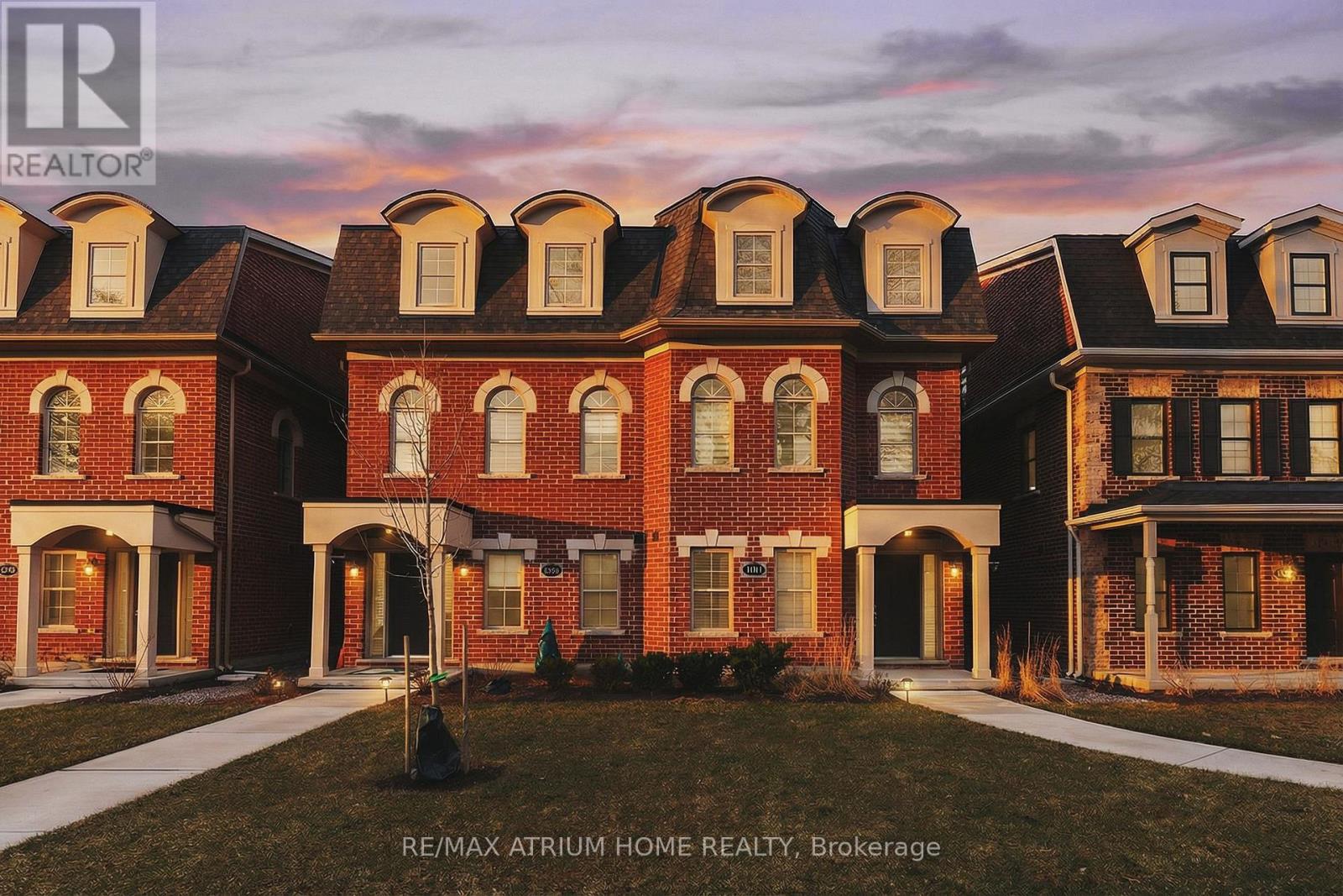 A building with a sign that says RE/MAX Atrium Home Realty, Brokerage.