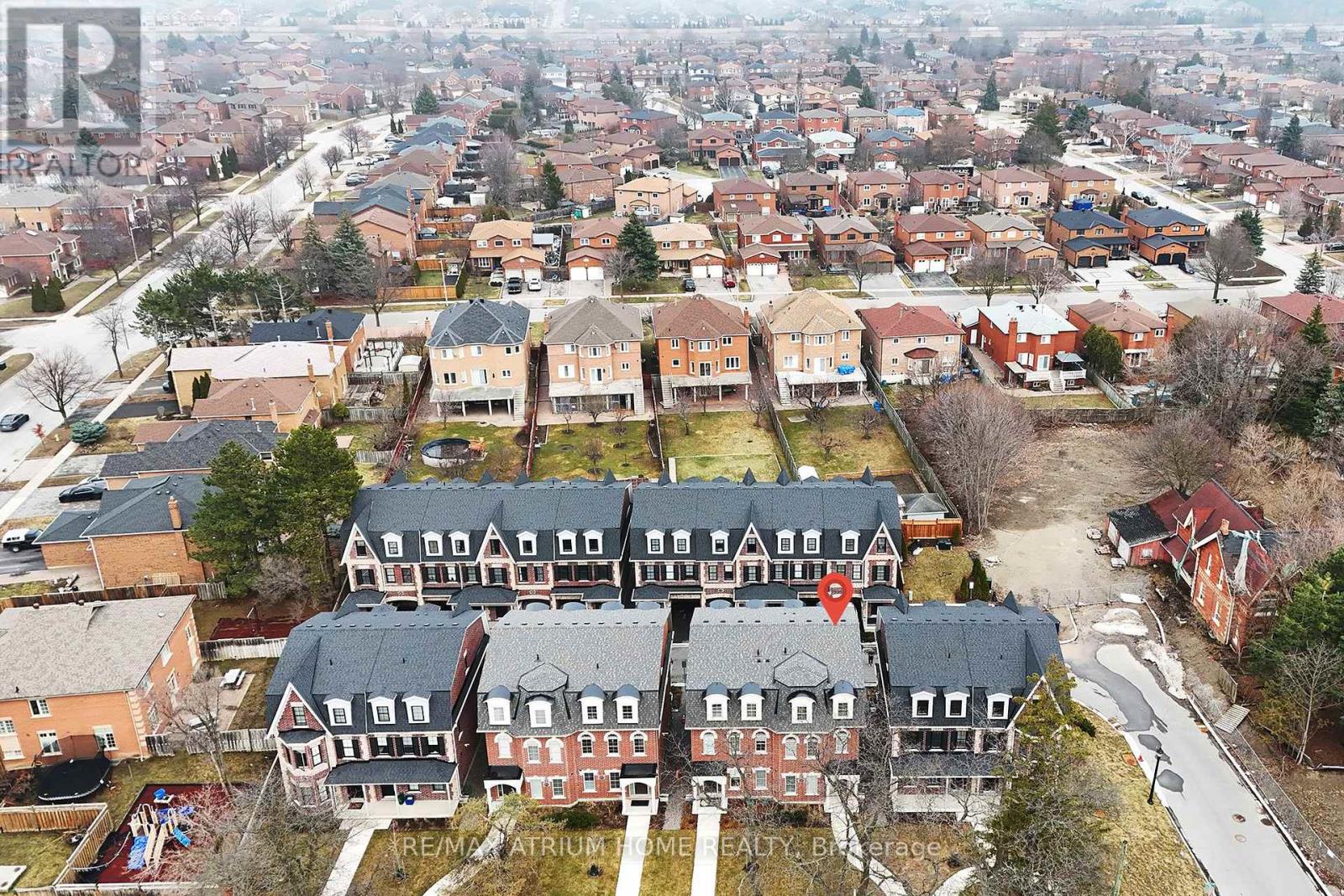 A bird's eye view of a residential area with houses and apartment buildings.
