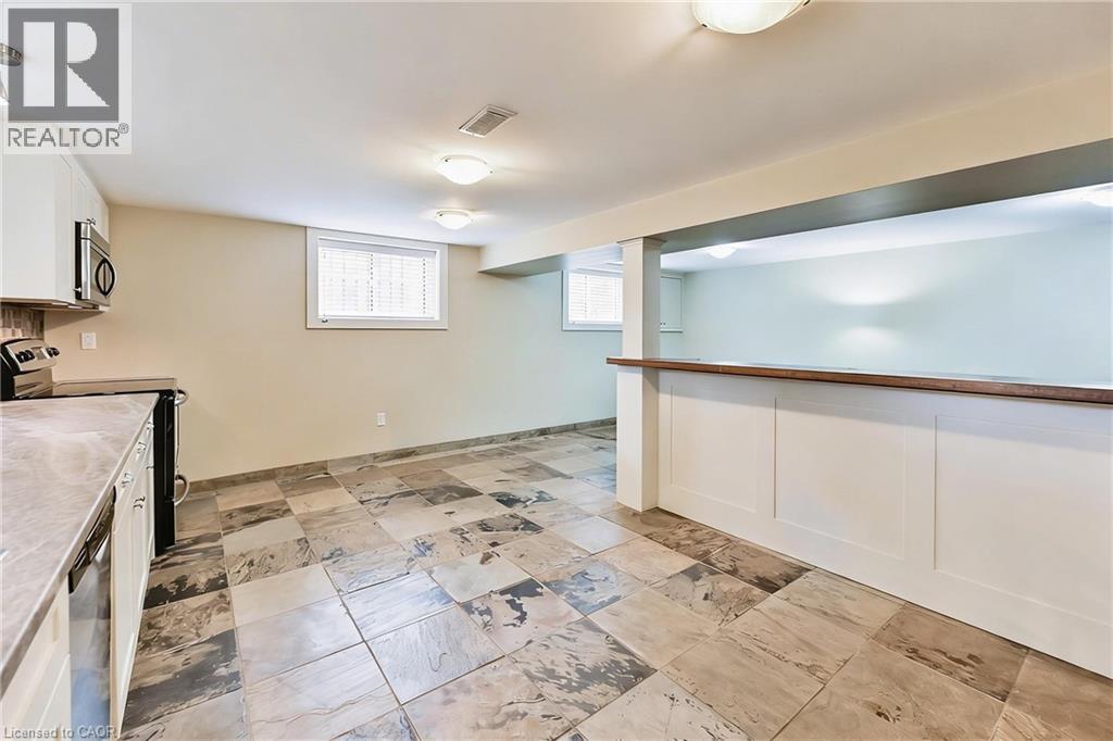 A kitchen with a tile floor and a counter top.