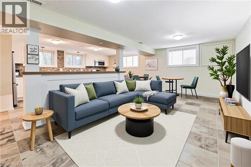A living room with a blue couch and a coffee table.