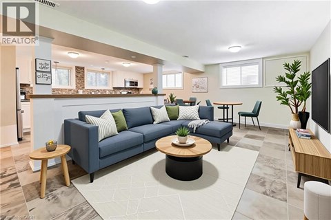 A living room with a blue couch and a coffee table.
