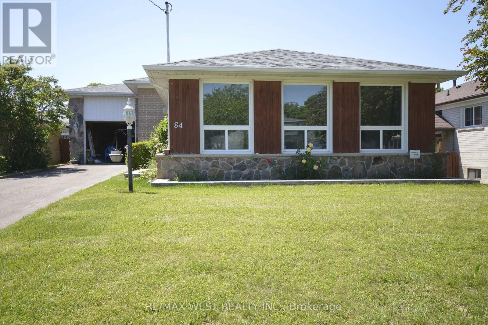 A house with a brown front door and windows is for sale.