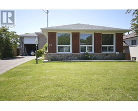 A house with a brown front door and windows is for sale.