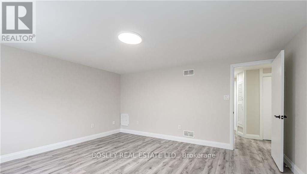 A room with a doorway leading to another room.