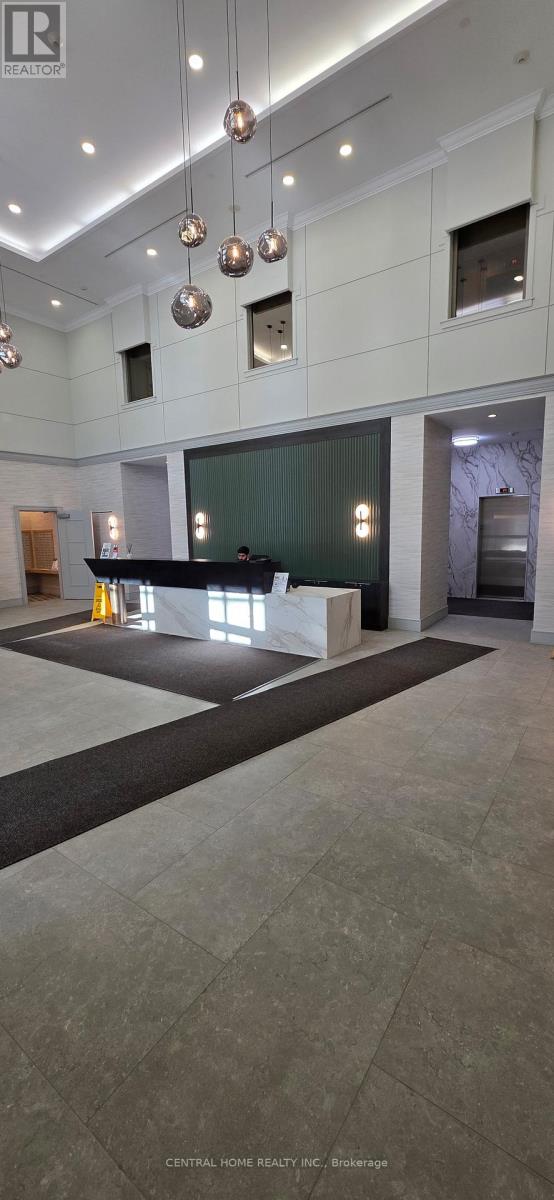 A spacious lobby with a black and white checkered floor.