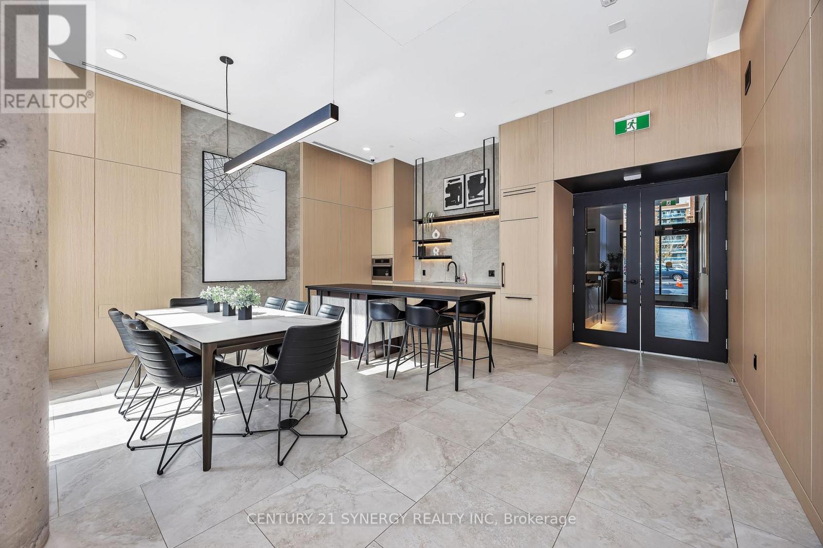A modern dining room with a table set for six.