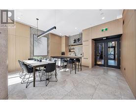 A modern dining room with a table set for six.