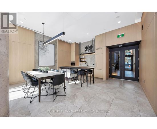 A modern dining room with a table set for six.