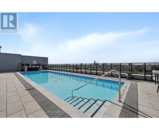 A pool with a metal railing around it.