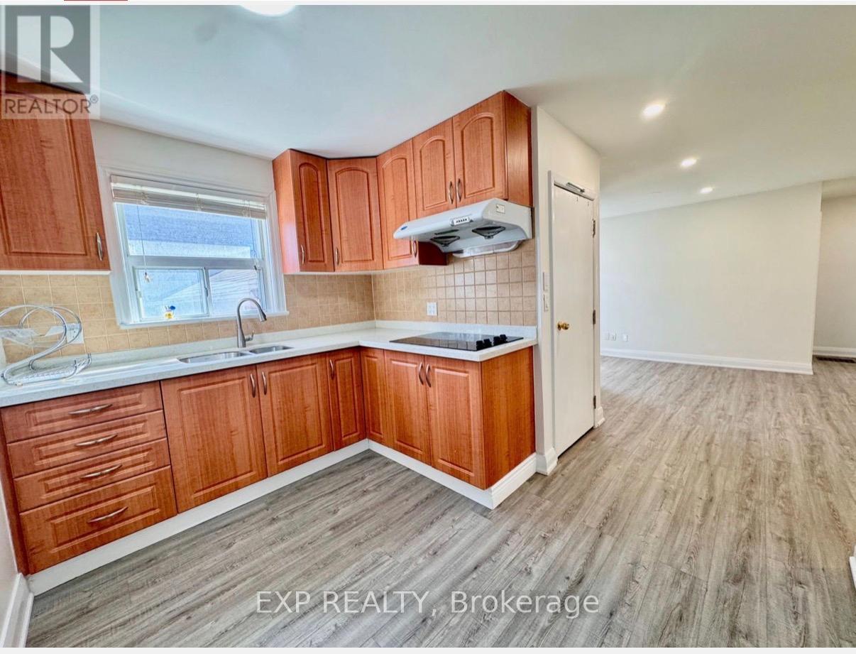 A kitchen with wooden cabinets and a white countertop.
