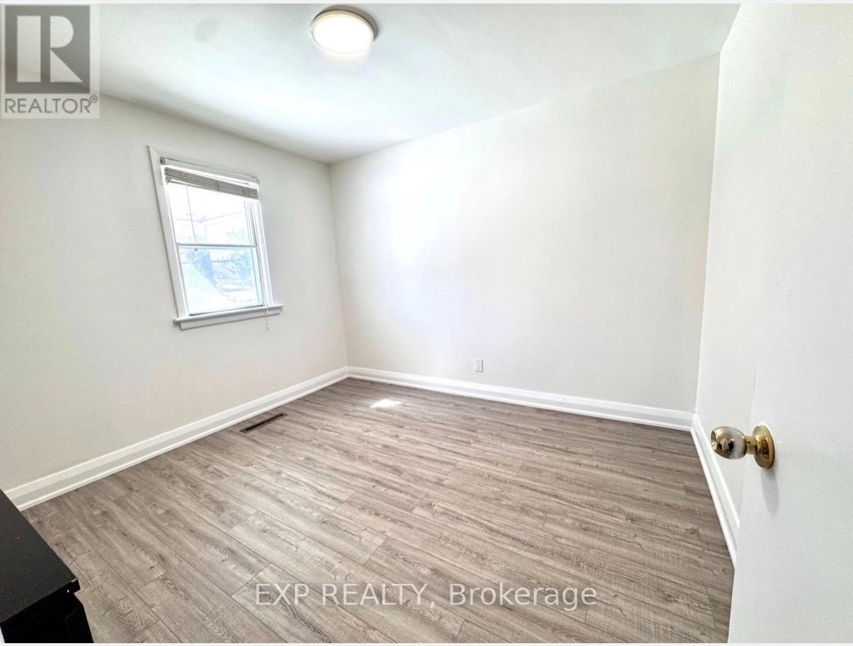 A room with EXP Realty Brokerage written on the floor.