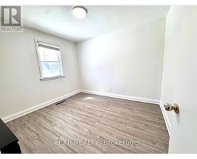 A room with EXP Realty Brokerage written on the floor.