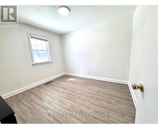 A room with EXP Realty Brokerage written on the floor.