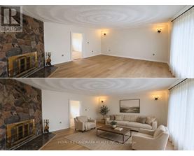 A living room with a stone fireplace and a couch.