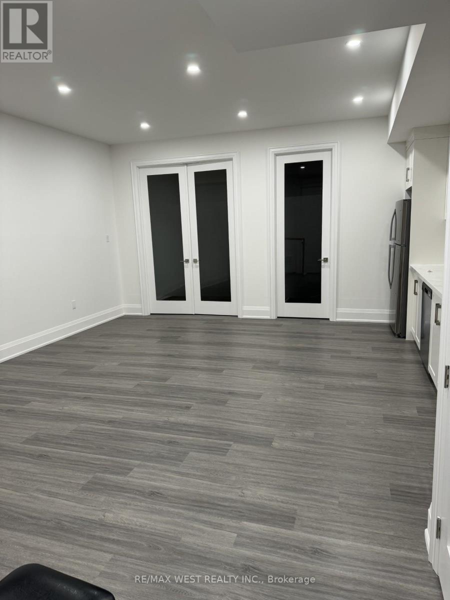 A room with grey flooring and white walls.
