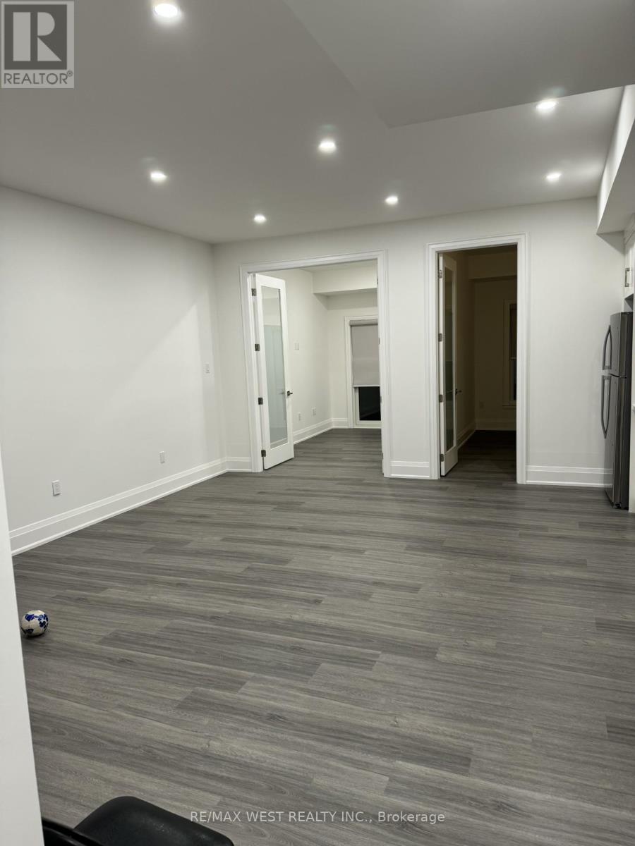 A room with grey flooring and white walls.