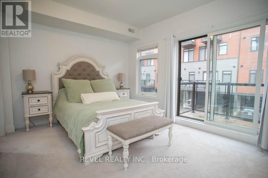 A bedroom with a large bed and a window overlooking a city.