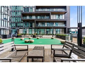 A modern building with a pool table and seating area.