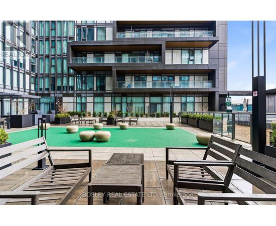 A modern building with a pool table and seating area.