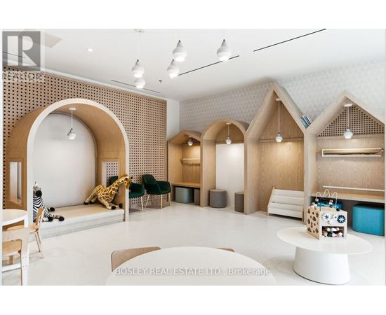 A modern living room with a white table and a giraffe plush toy.