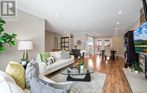 A well-lit living room with a white sofa and a coffee table.