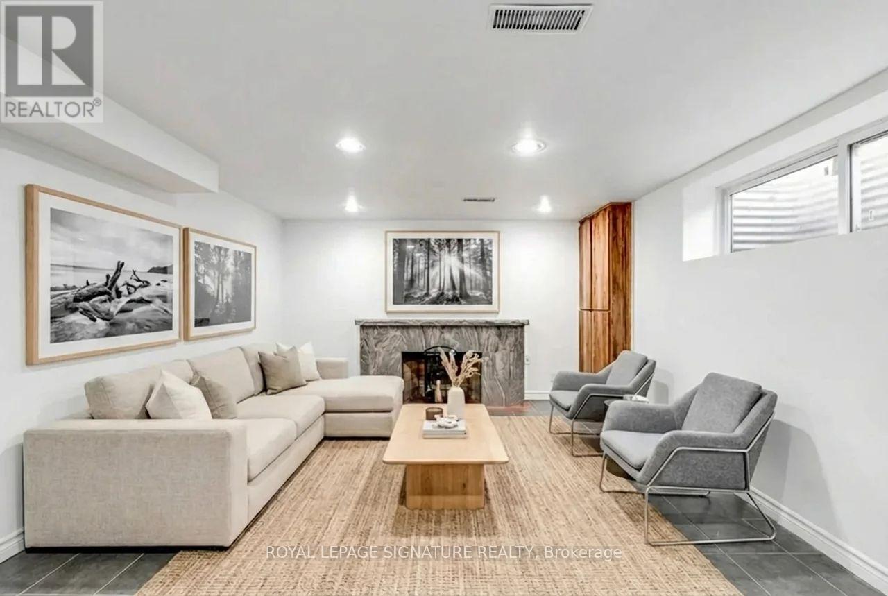 A living room with a fireplace and a couch.