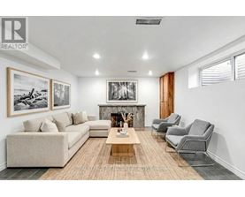 A living room with a fireplace and a couch.