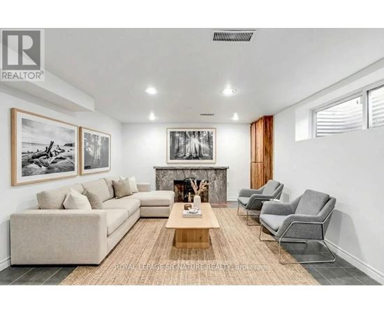 A living room with a fireplace and a couch.