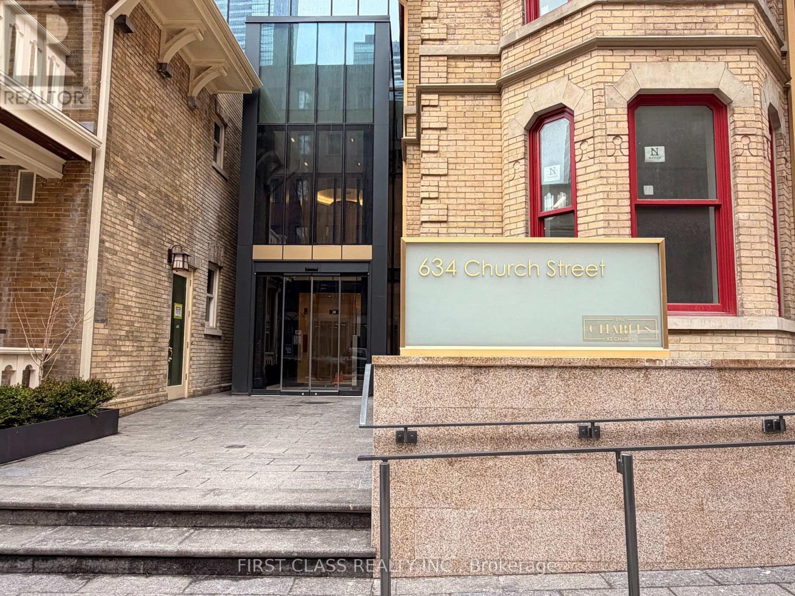 The entrance to a building with a glass door and a sign that reads "634 Church Street".