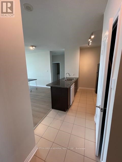 A kitchen area with a sink and a counter.