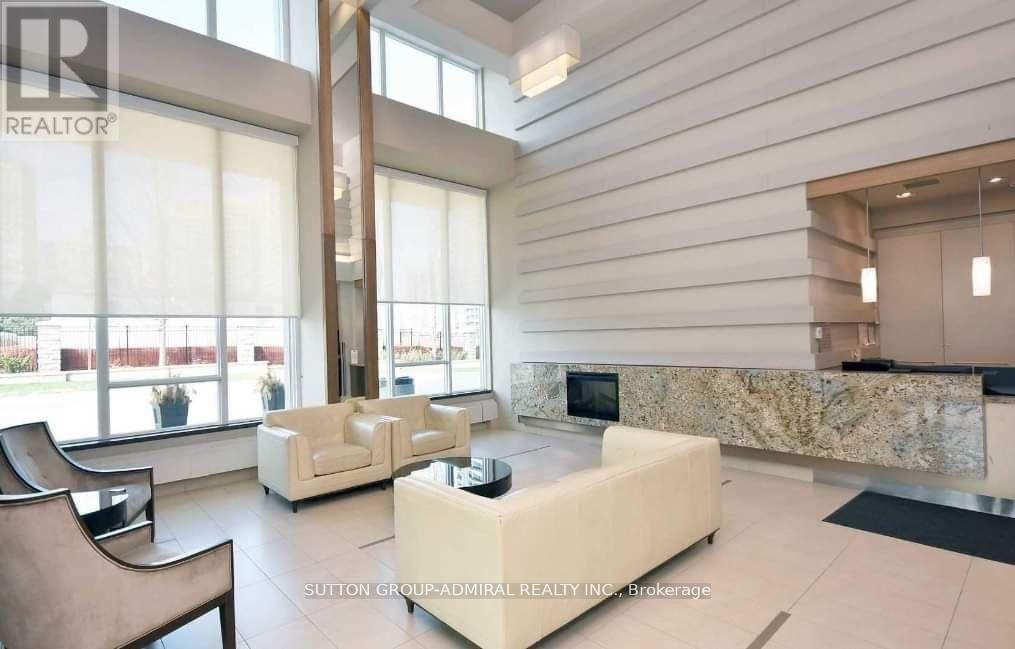 A modern living room with a large window and a marble countertop.