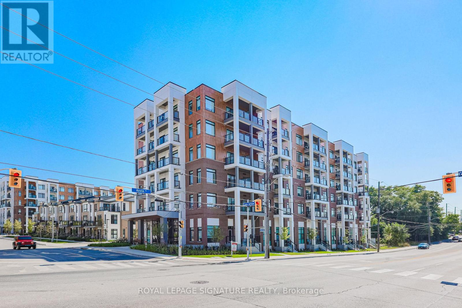 A multi-story building with a clear blue sky in the background.
