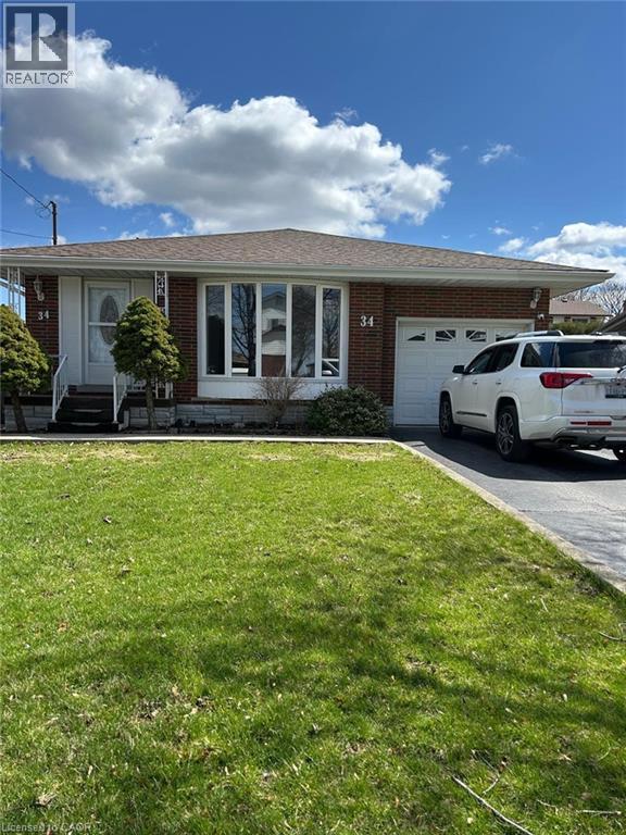 A house with a white car parked in front.