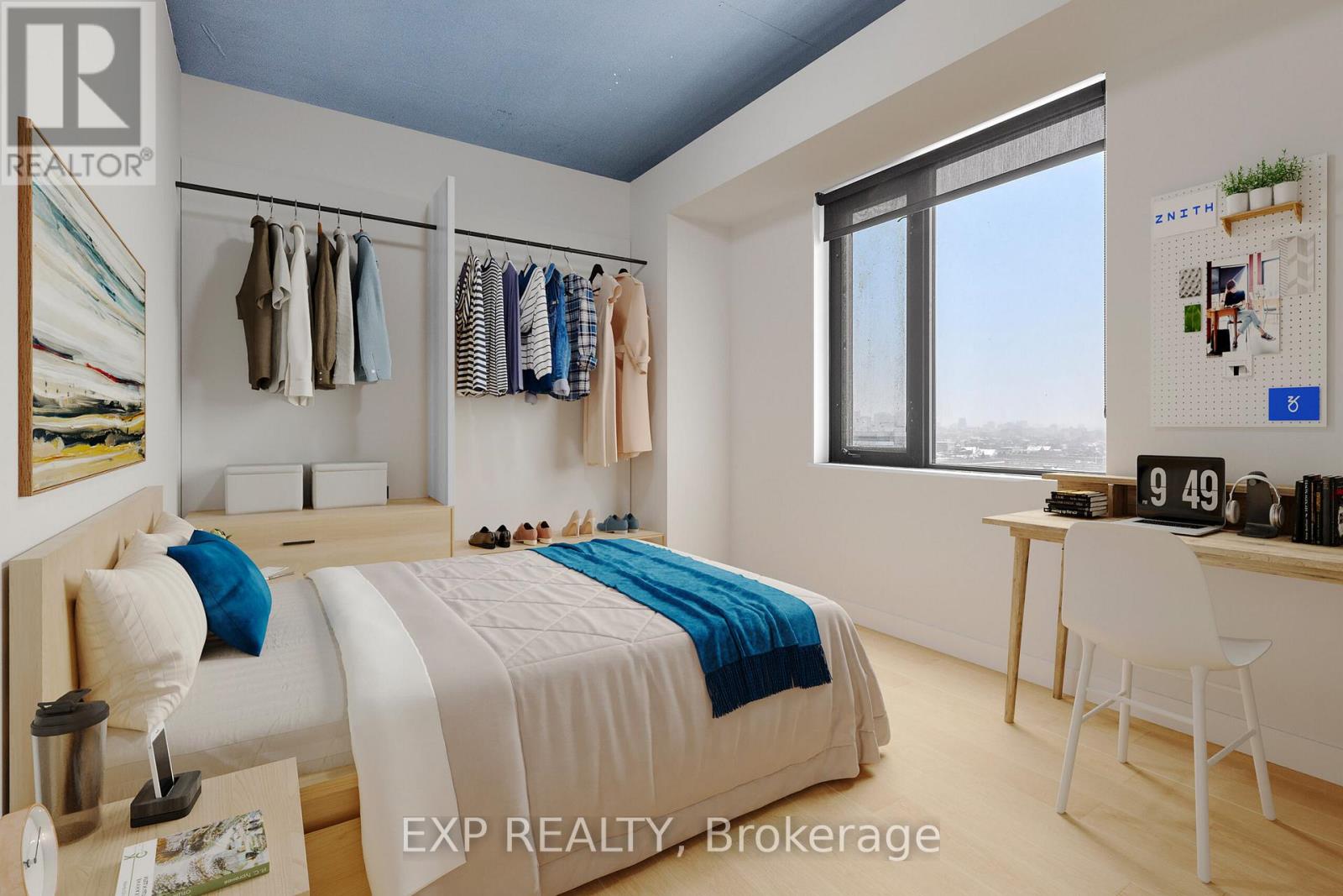 A bedroom with a bed, desk, and clothing rack.