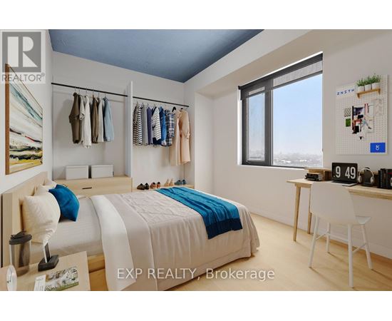 A bedroom with a bed, desk, and clothing rack.