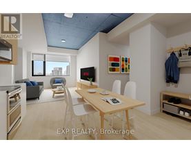A modern kitchen with a dining table and chairs.