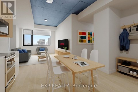 A modern kitchen with a dining table and chairs.
