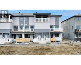 A row of new townhouses are under construction.