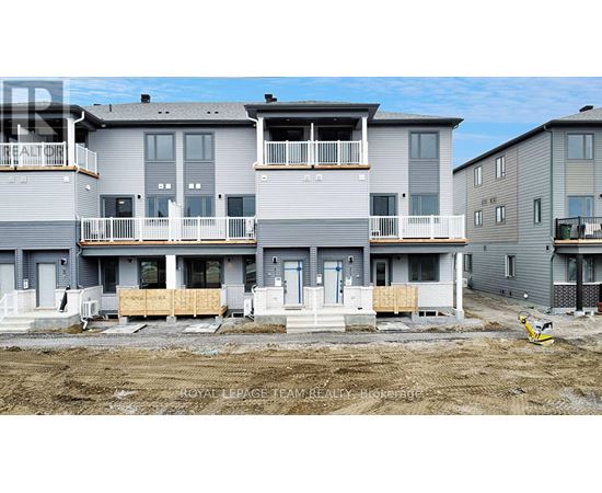 A row of new townhouses are under construction.
